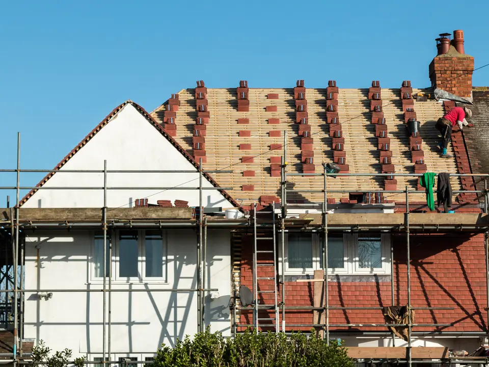 House being re-tiled under scaffolding